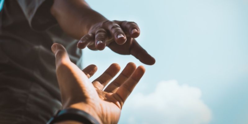 myths-misconceptions-merchant-cash-advances-debunked One helping hand reaching for another